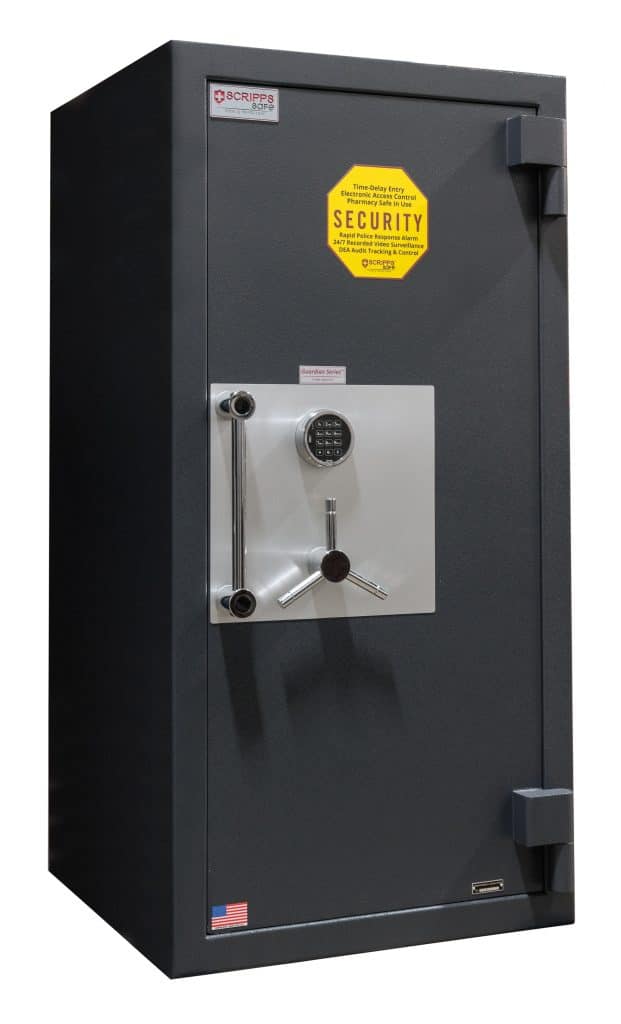 A black safe with a yellow sticker on it.