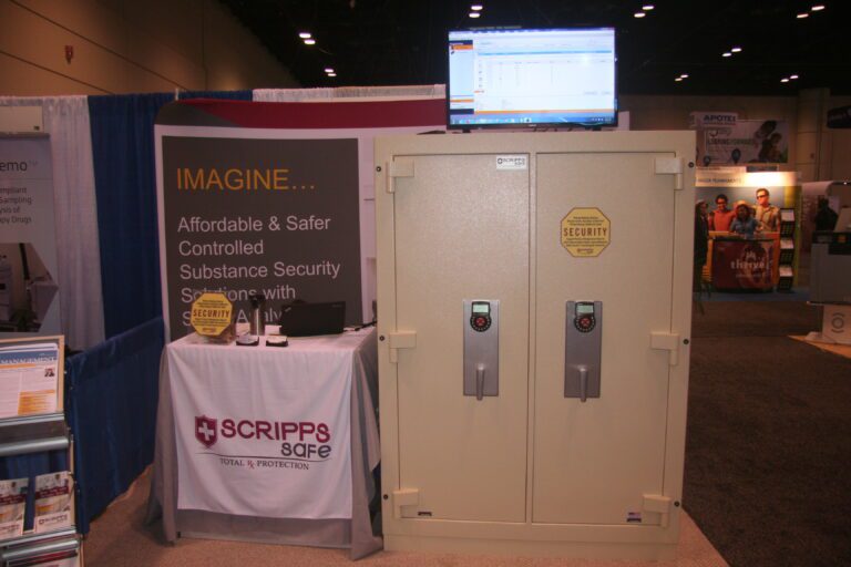 A booth with two large safes and a table.